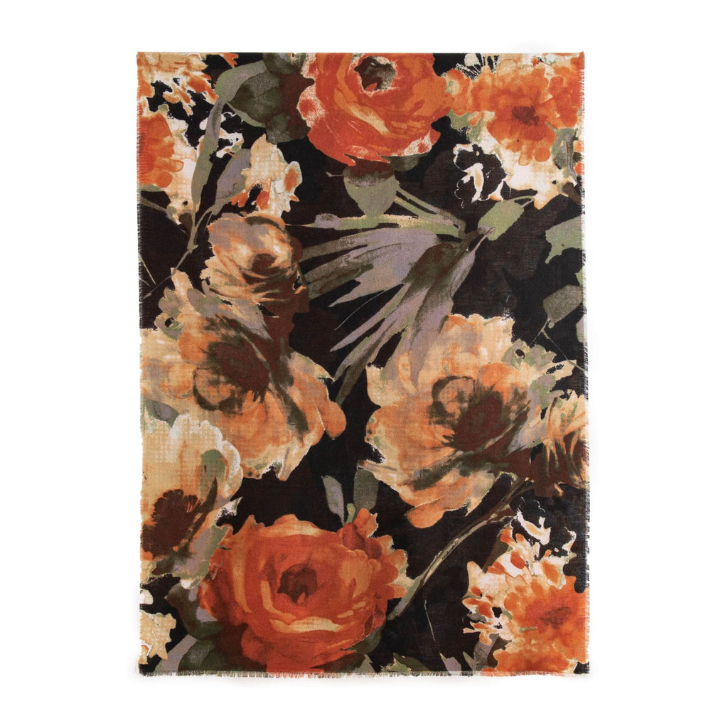 Floral patterned rug with orange and black colors on a white background