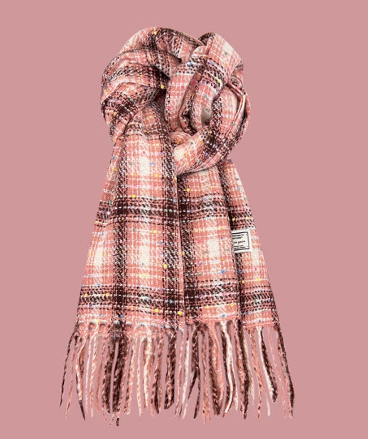 Plaid scarf with fringes on a pink background