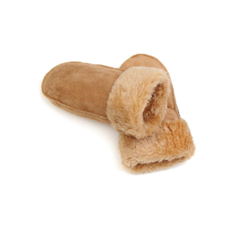 Pair of brown slippers with fuzzy texture on a white background