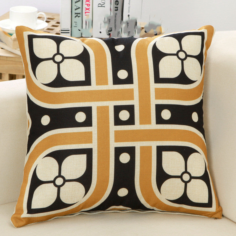 Decorative pillow with geometric pattern on a couch