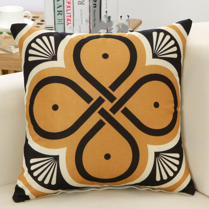 Decorative pillow with geometric pattern on a couch
