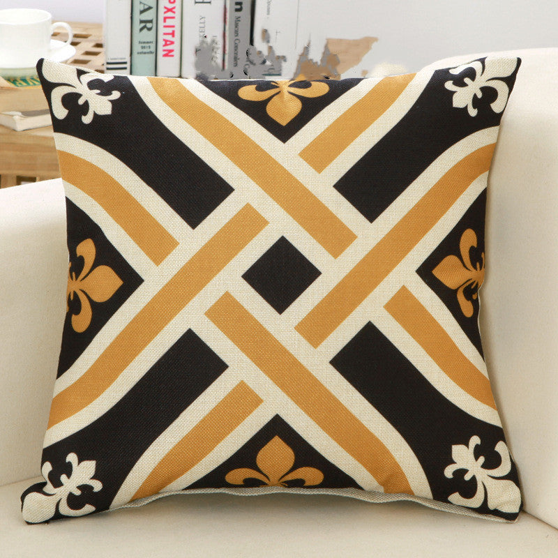 Decorative pillow with geometric pattern on a white couch