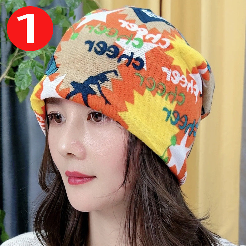 Person wearing a colorful headscarf with text and patterns