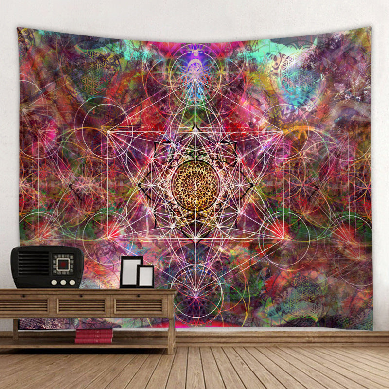 Colorful tapestry with geometric patterns hanging on a wall above a wooden shelf.
