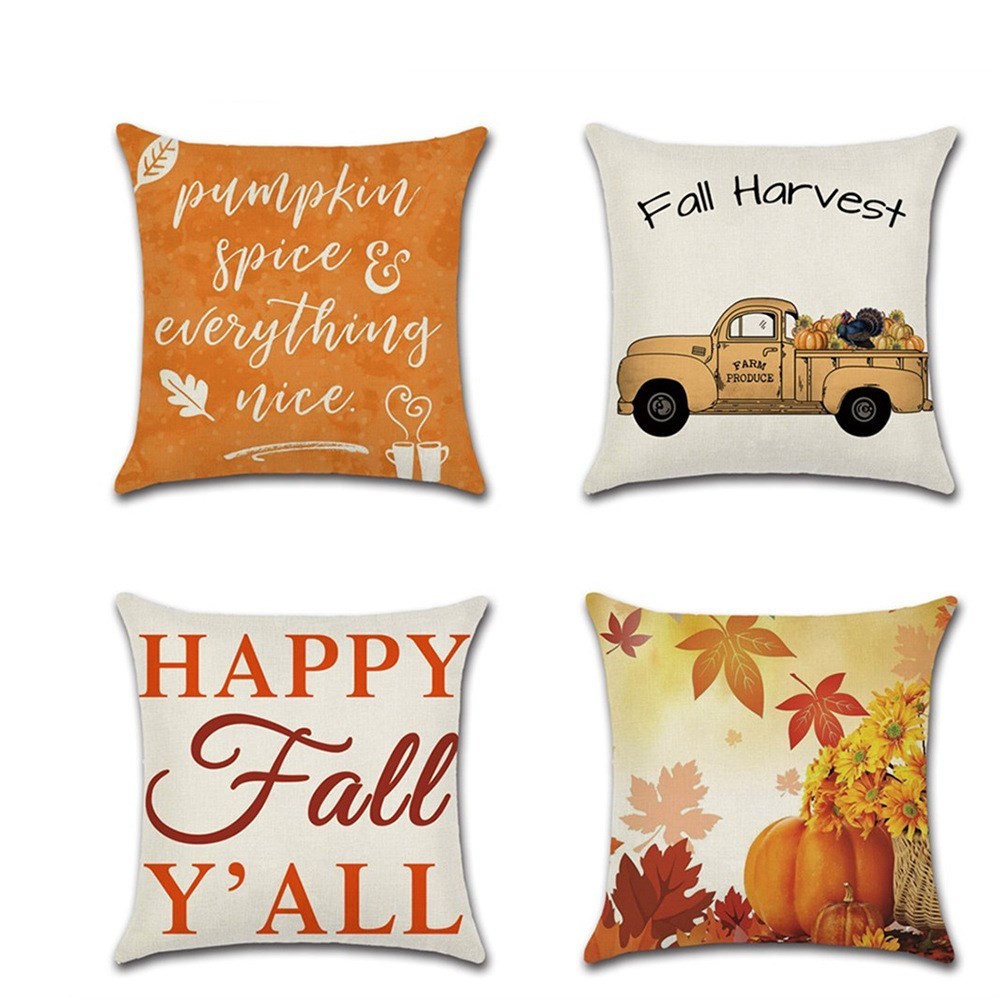 Four fall-themed pillows with different designs on a white background.