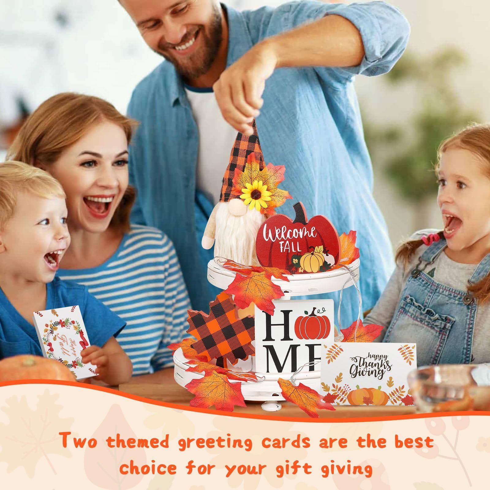 Family gathered around a decorative fall-themed centerpiece with greeting cards.