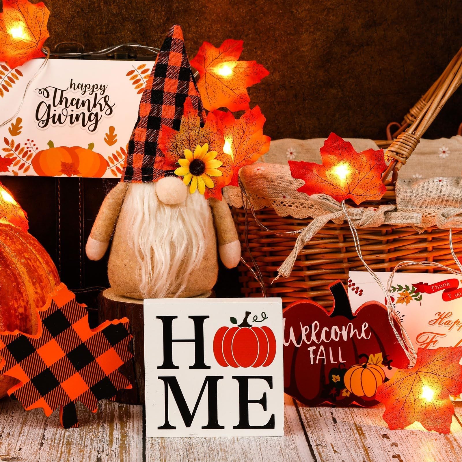 Autumn-themed decor with a gnome, pumpkins, and 'Welcome Fall' sign.