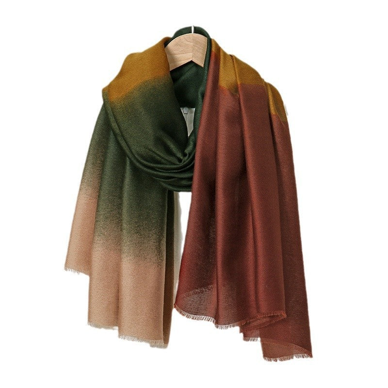 Gradient scarf in green, brown, and beige on a hanger against a white background