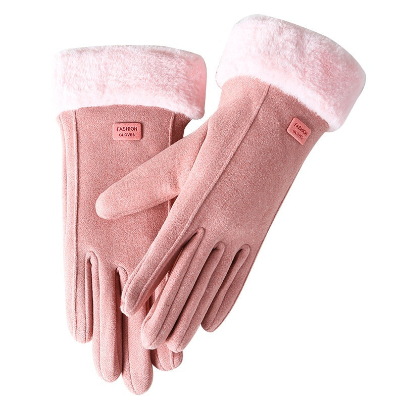 Pair of pink gloves with white cuffs on a white background