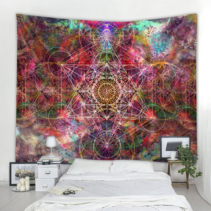 Colorful tapestry with geometric patterns hanging above a bed in a room.