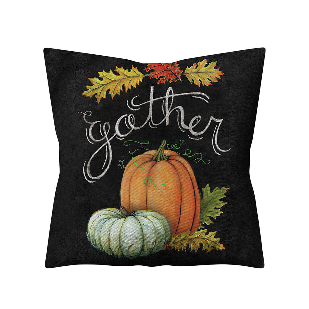 Decorative pillow with pumpkins and leaves on a black background