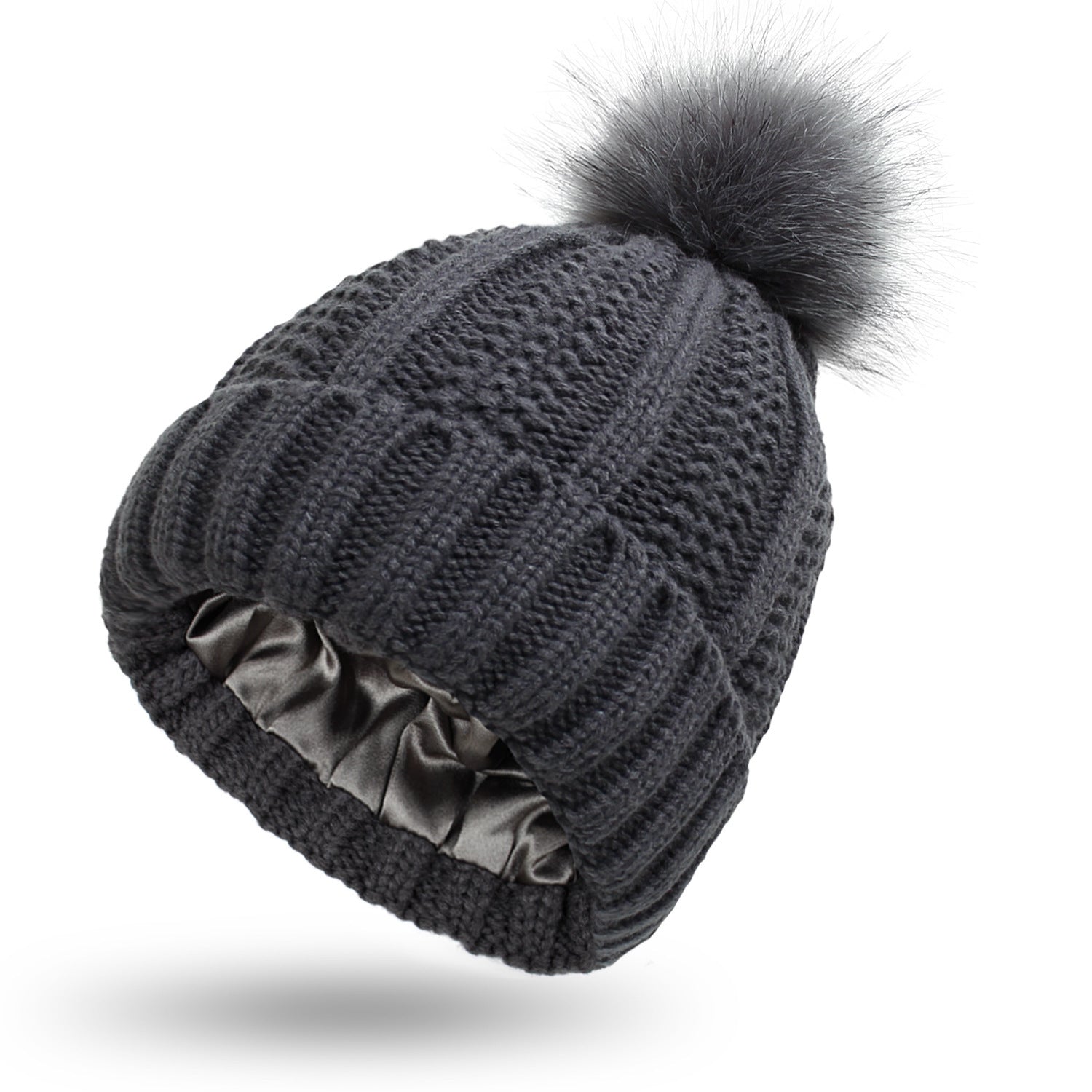 Dark gray knit beanie with a fluffy pom-pom on a white background