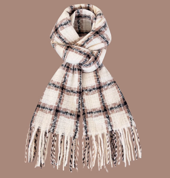 Plaid scarf with fringes on a brown background