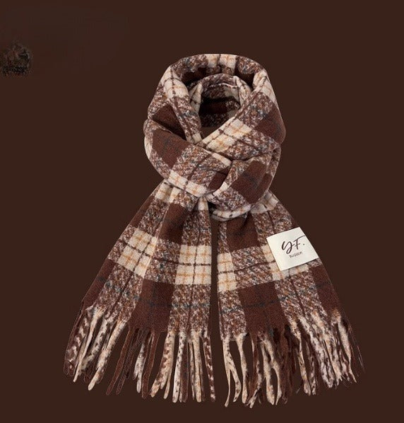 Plaid scarf with fringes on a brown background