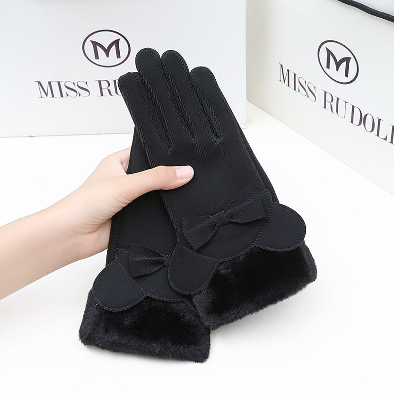 Black gloves with bow design held by a hand, against a white background with 'MISS RUDOLPH' branding.