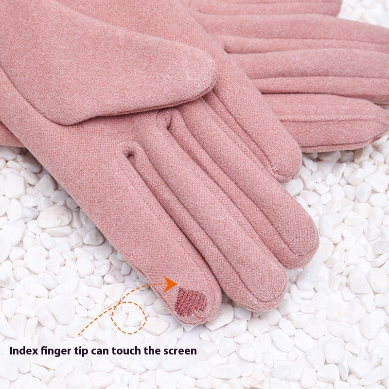 Pink gloves with text indicating the index finger can touch the screen on a white stone surface.