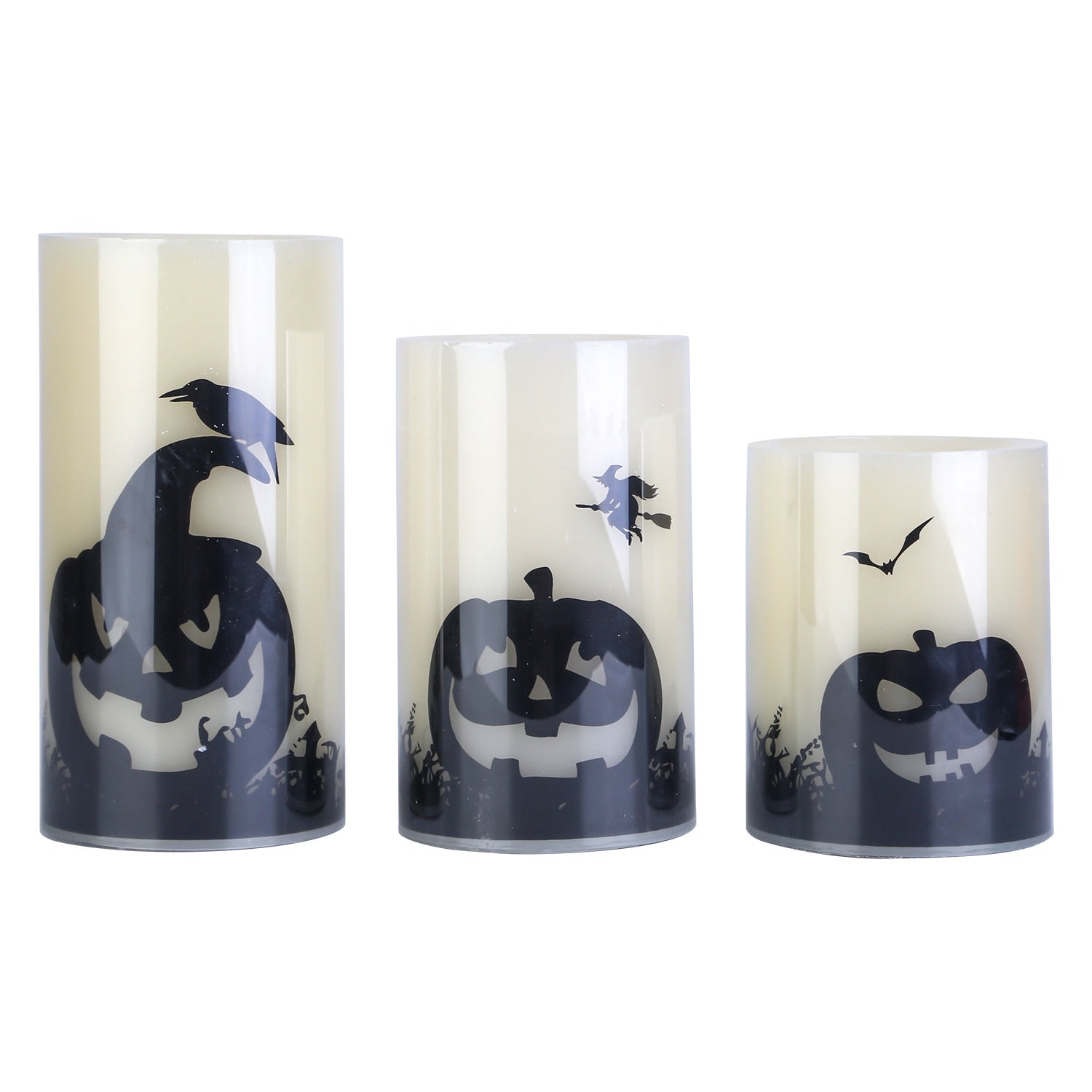 Set of three Halloween-themed candles with jack-o'-lantern designs on a white background