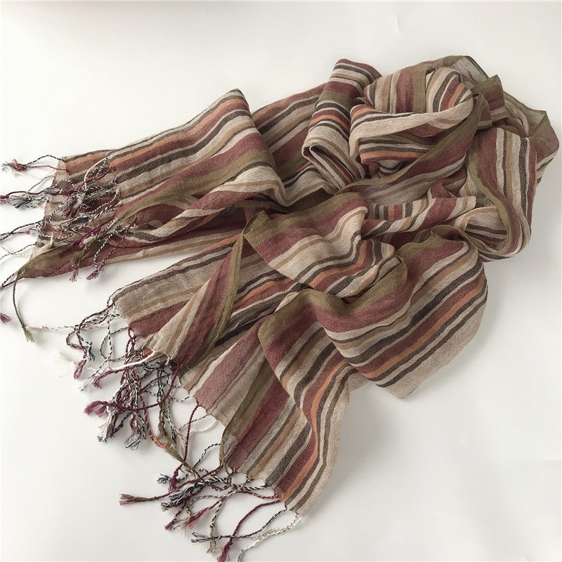 Striped scarf with brown and beige colors on a white background