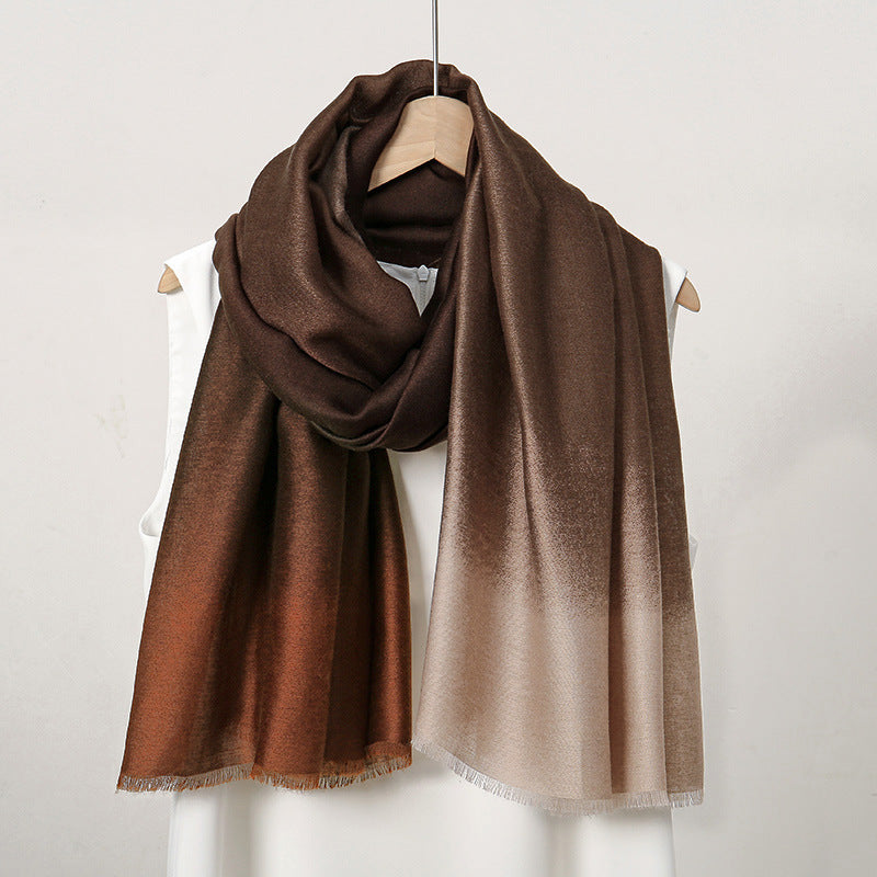 Brown scarf draped over a mannequin on a white background