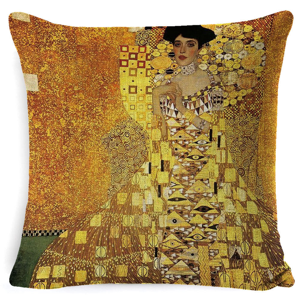 Decorative pillow with a design inspired by Gustav Klimt's 'The Kiss' on a white background