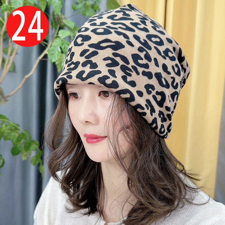 Person wearing a leopard print hat with a blurred background