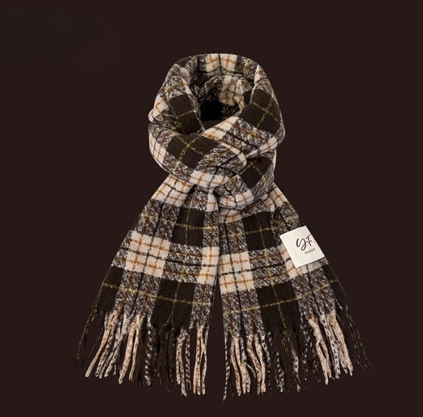 Plaid scarf with fringes on a dark background
