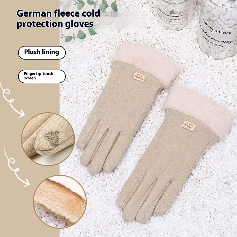 Beige gloves with plush lining and touch screen tips on a textured surface.