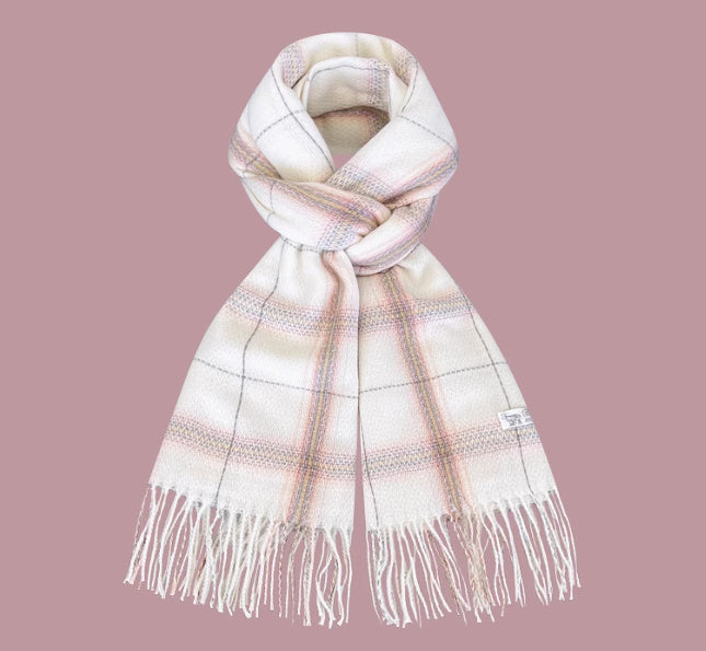 Plaid scarf with fringes on a pink background