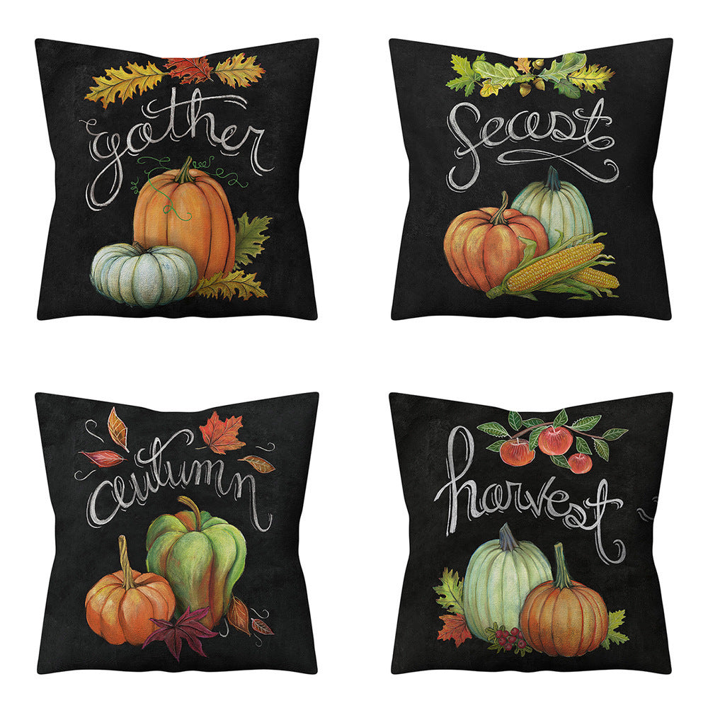 Four black pillows with autumn-themed designs featuring pumpkins, leaves, and text on a white background.