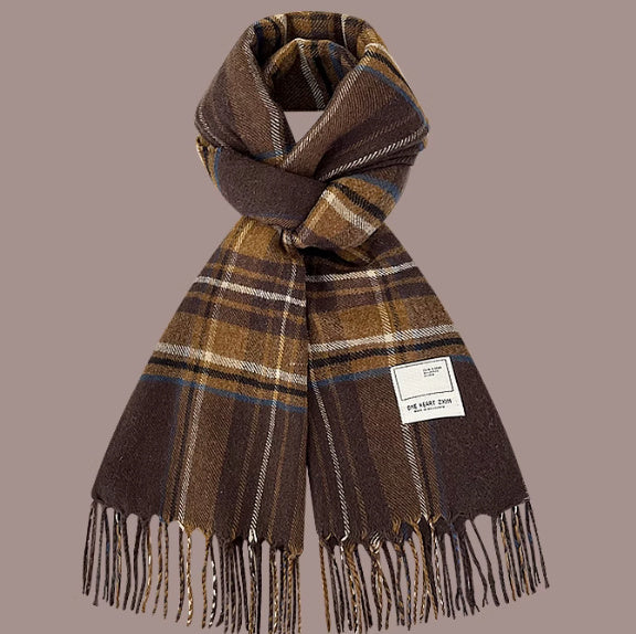 Plaid scarf with fringes on a beige background