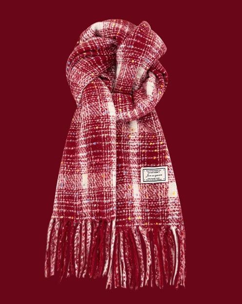 Plaid scarf with fringes on a red background