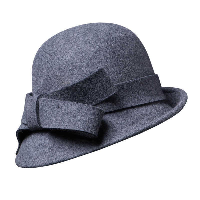 Gray felt hat with a large bow on a white background