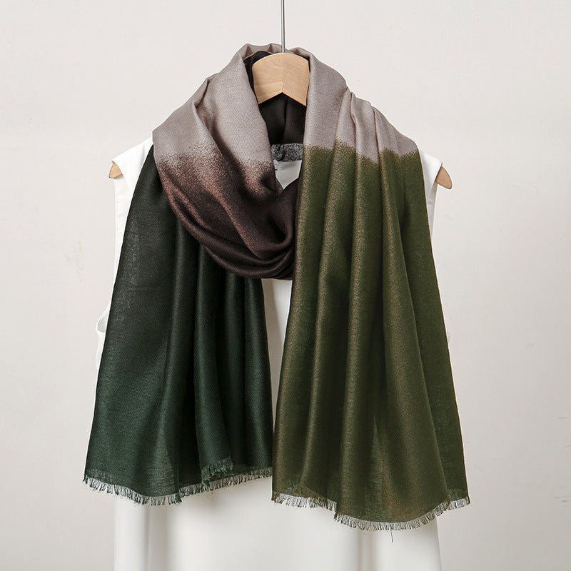 Ombre scarf with gradient from green to gray on a mannequin against a plain background