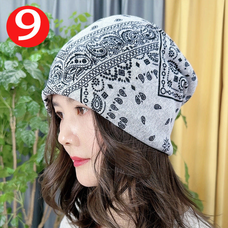 Woman wearing a patterned headscarf with a blurred background