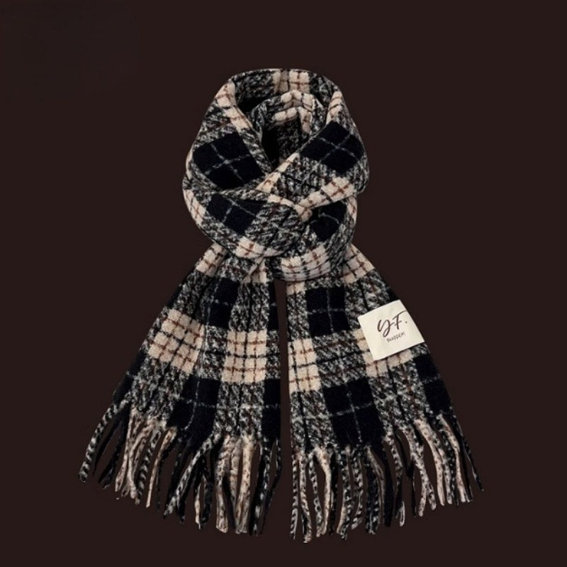 Plaid scarf with fringes on a brown background