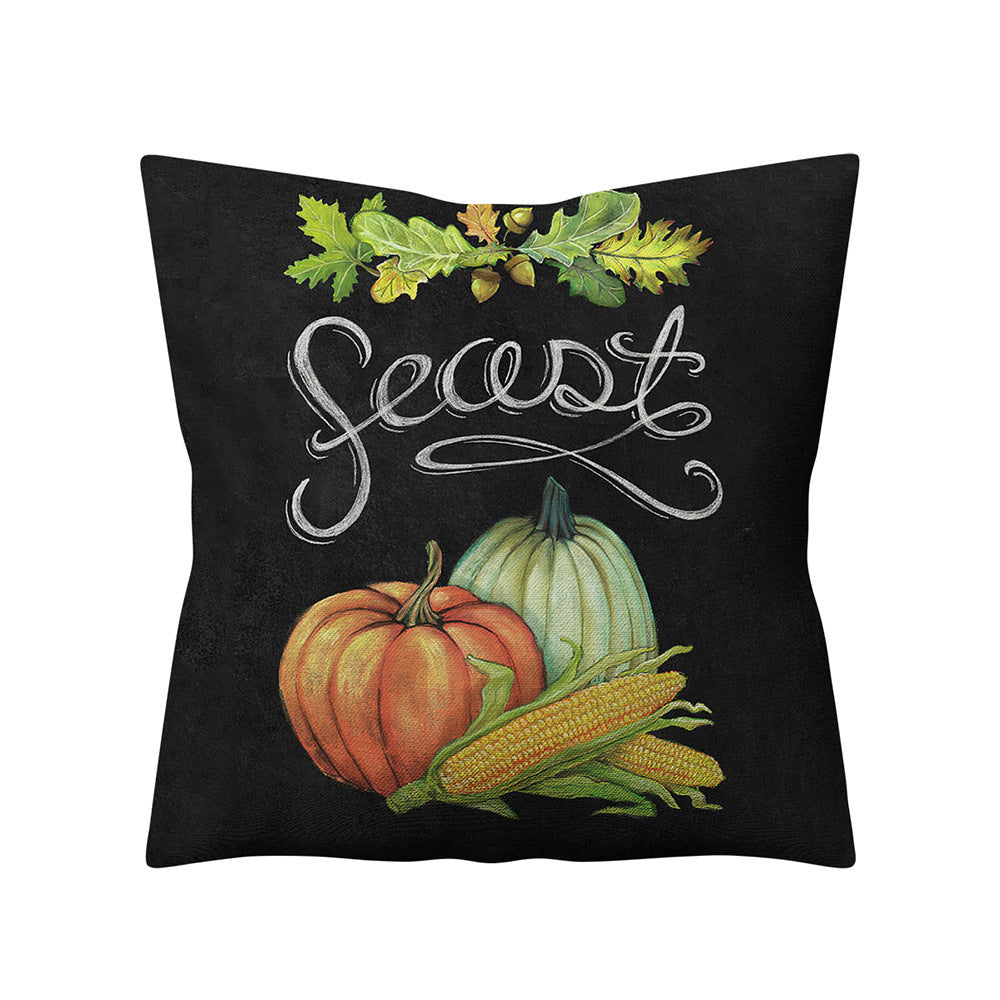 Decorative pillow with pumpkins, corn, and the word 'Seest' on a black background