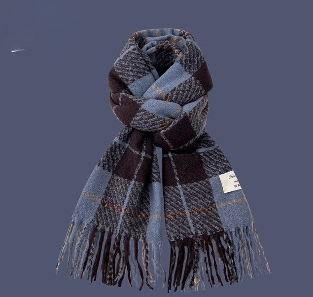 Plaid scarf with fringes on a solid background